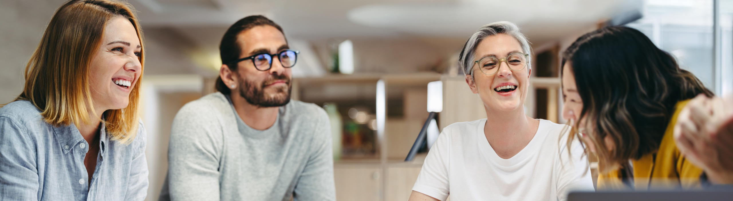 Happy design professionals having a meeting in an office