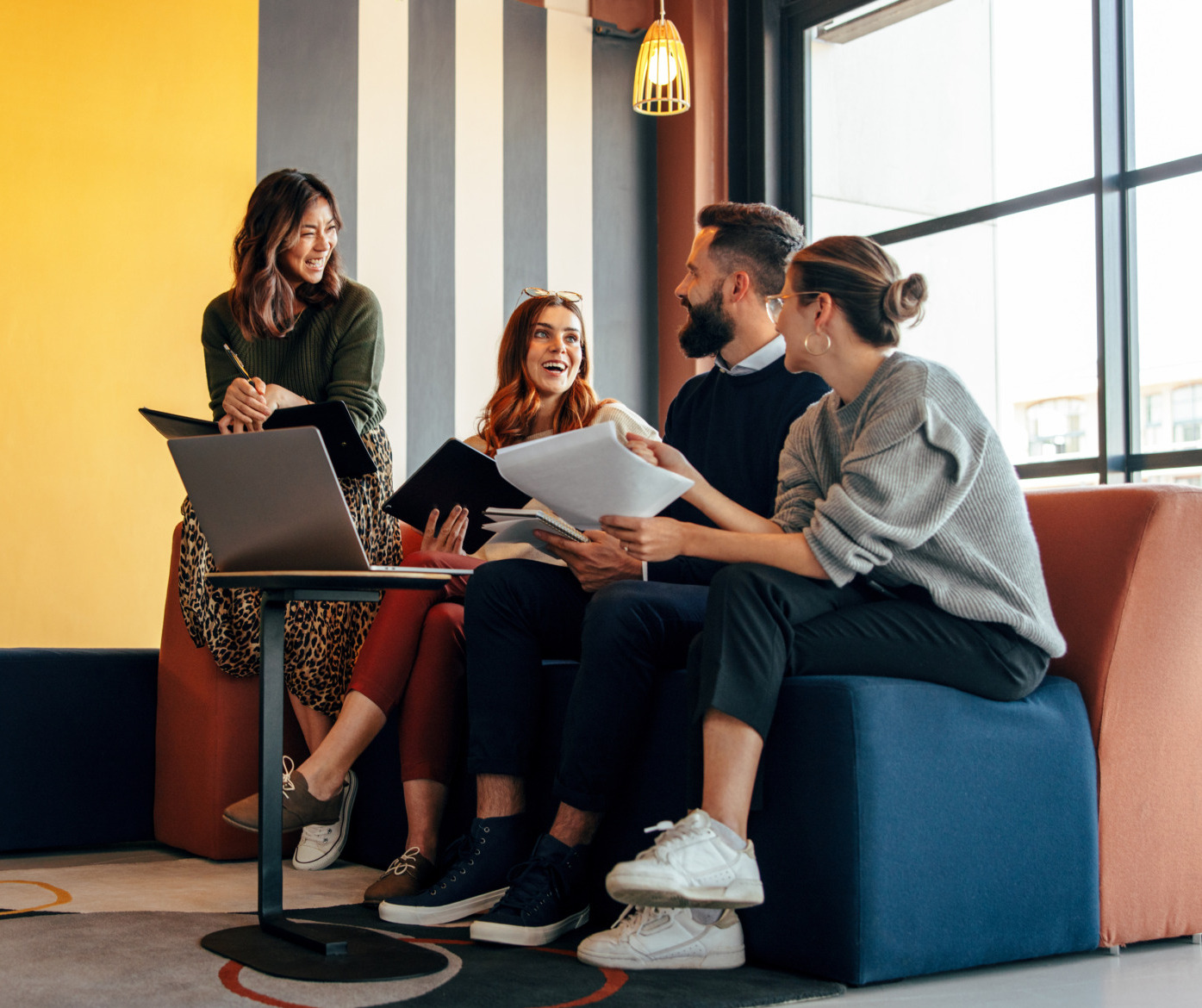 Multicultural businesspeople working in an office lobby